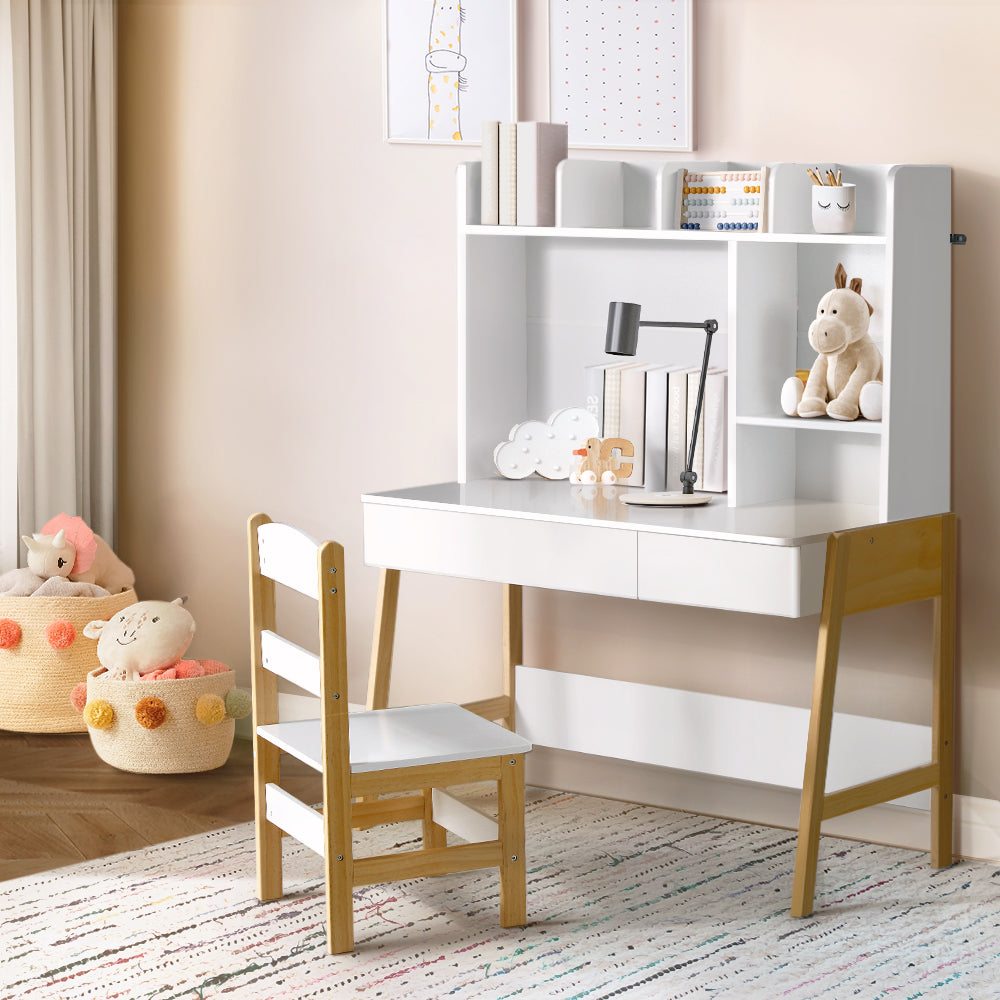 "Colorful kids bedroom with mini desk, toy chest, and bookshelf beside toddler bed"