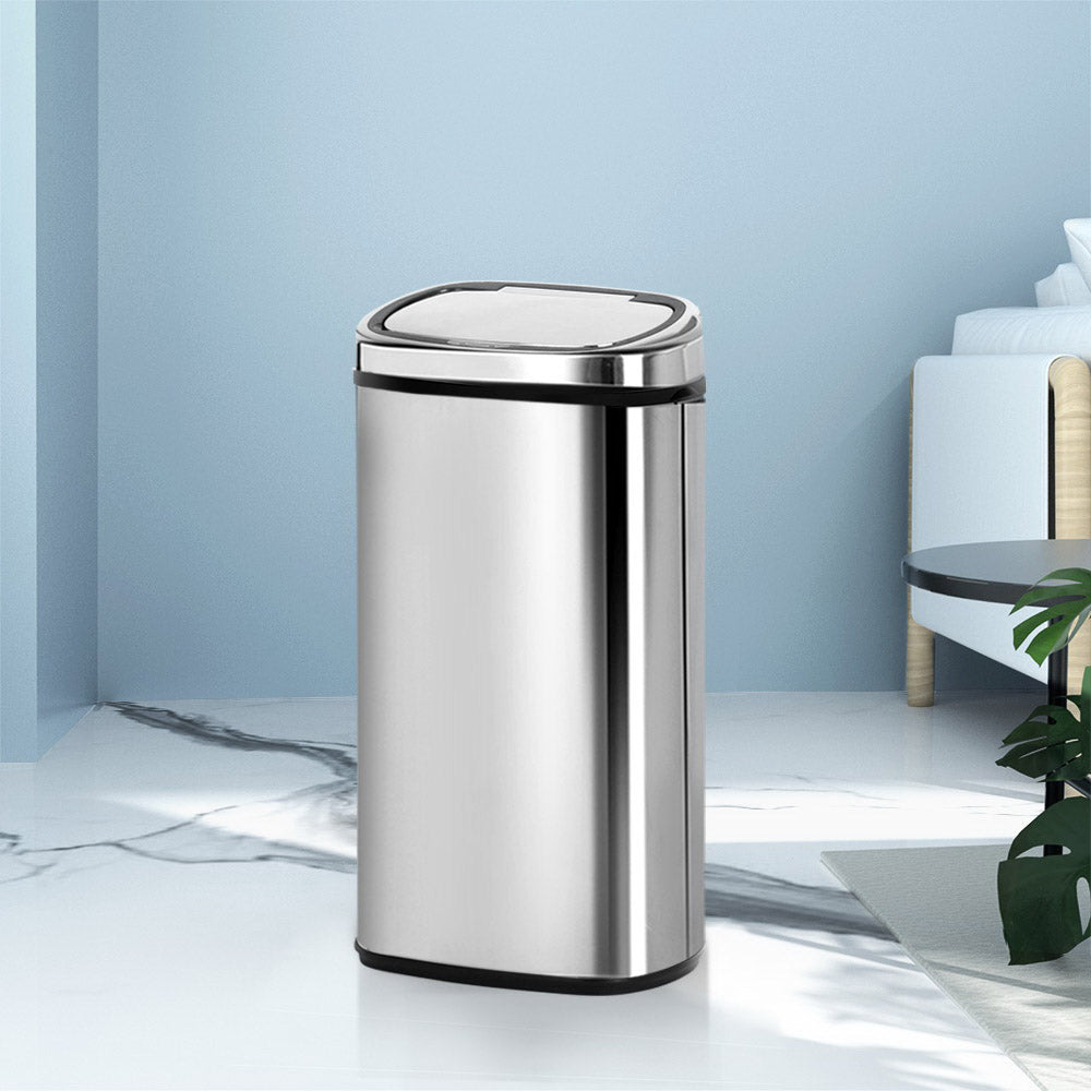 Modern kitchen bins for waste and recycling management.