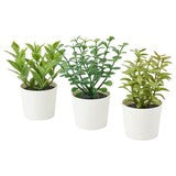 Decorative artificial potted plants for indoor display.