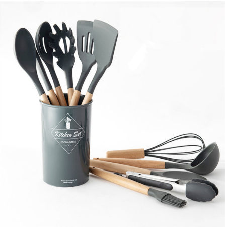 "Modern kitchen setup with stainless steel cookware, bamboo utensils, and food storage containers"