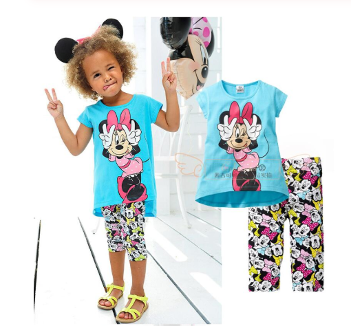 "Newborn baby wrapped in a soft blanket surrounded by bottles, pacifier, and baby wipes"