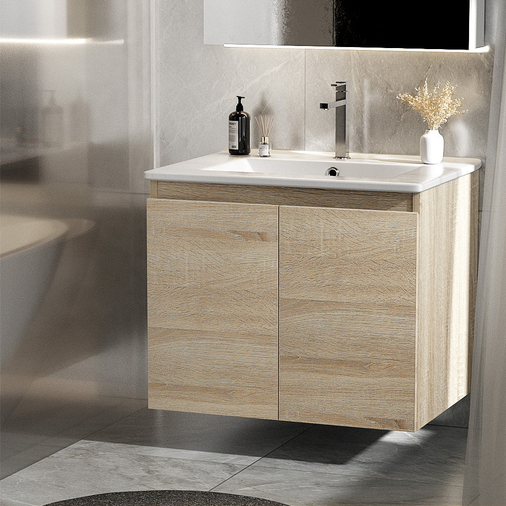 Bathroom vanity units with sink and storage drawers.